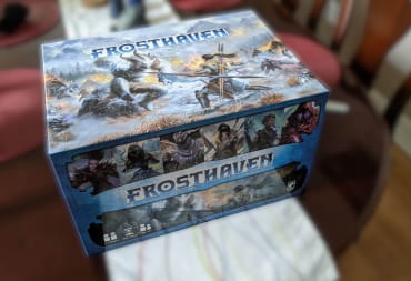 The box for Frosthaven sitting against a blurry background
