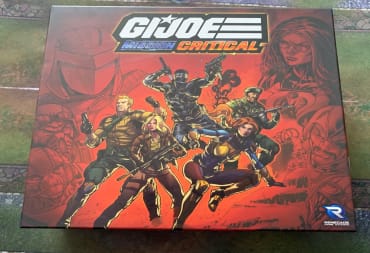 The game box of GI Joe: Mission Critical on a game mat.