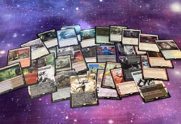 An image of a pile of new MTG cards from Phyrexia All Will Be One